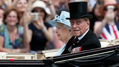 Britain's Queen Elizabeth II and Prince Philip, the Duke of Edinburgh return to Buckingham Palace in a carriage, after attending the annual Trooping the Colour Ceremony in London, Saturday, June 17, 2017. (AP Photo/Kirsty Wigglesworth)
